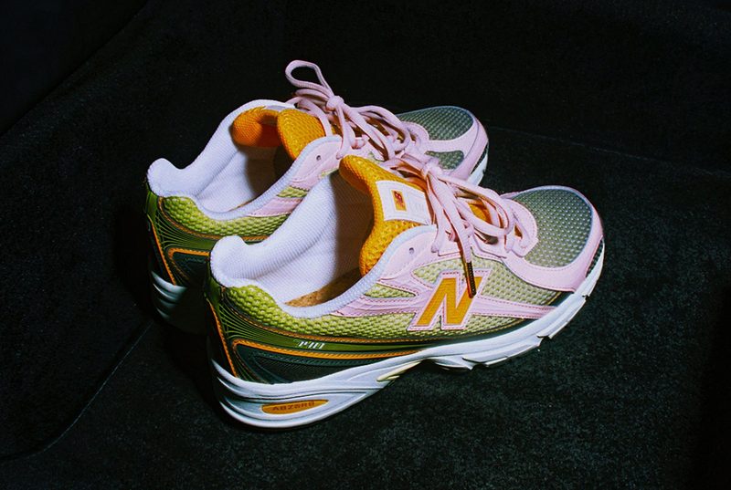 pair of new balance sneakers in the dark with flash