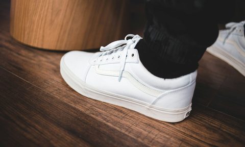 Man wearing white sneakers