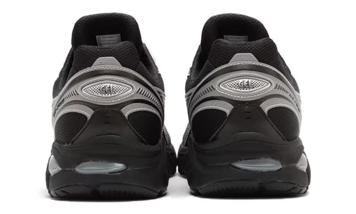 close up on heels of black and grey sneaker