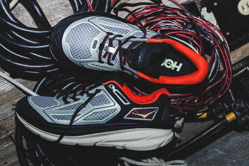silver and red sneakers in a pile