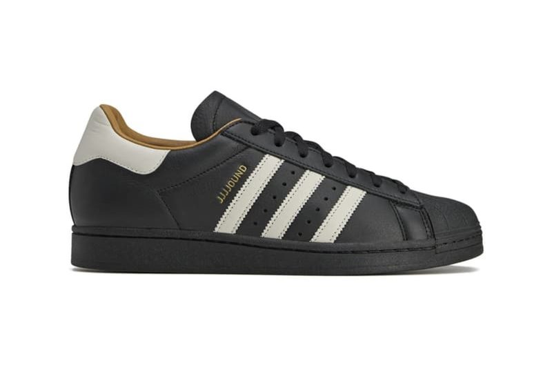 right side of black leather adidas superstar sneaker