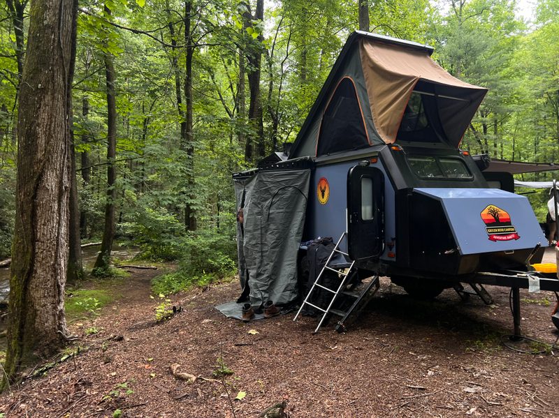 A Kruger Bush Camper set up at a campsite.