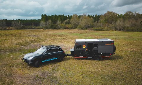 A Kruger Bush camper in a field.