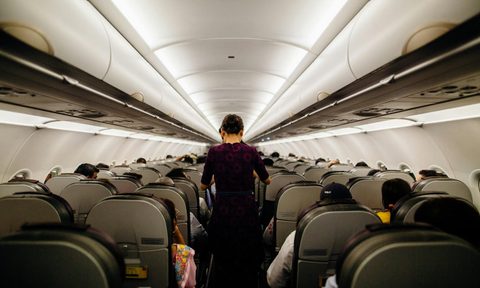 Person standing on an airplane