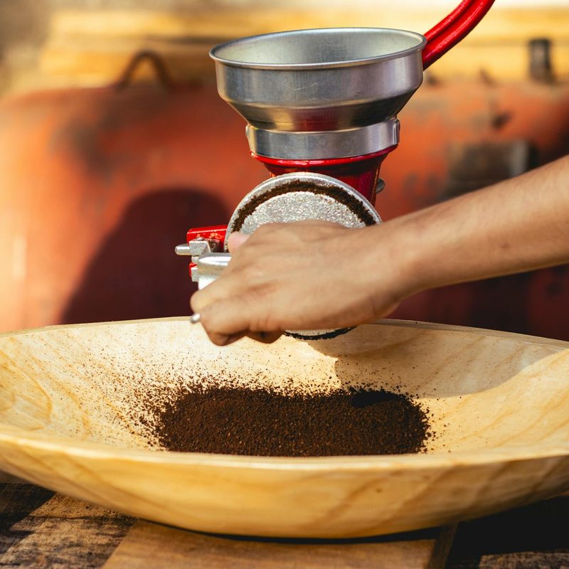 Pouring coffee grounds