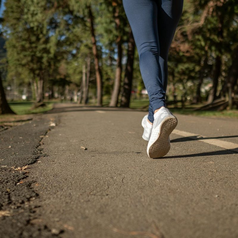 Woman's shoes on a road outside jogging outdoors