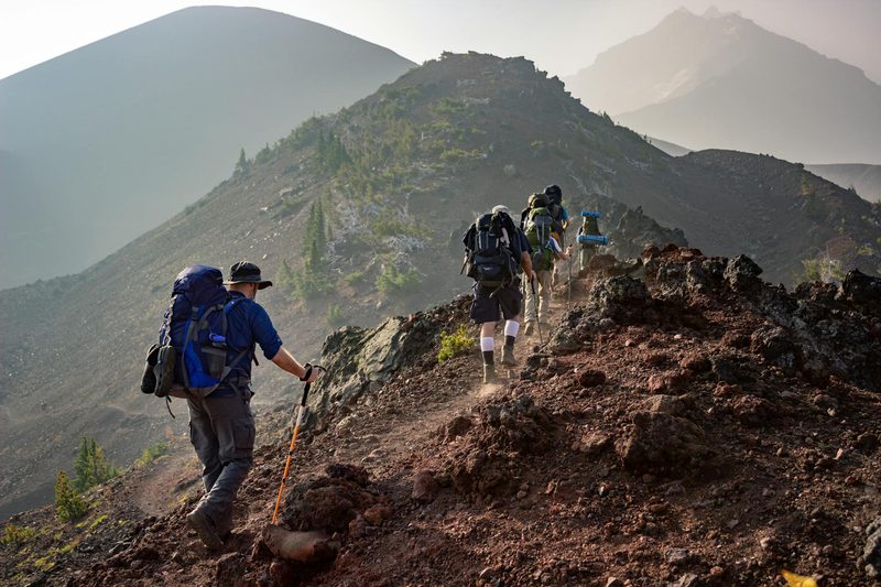 people men hiking hilly mountain outdoors