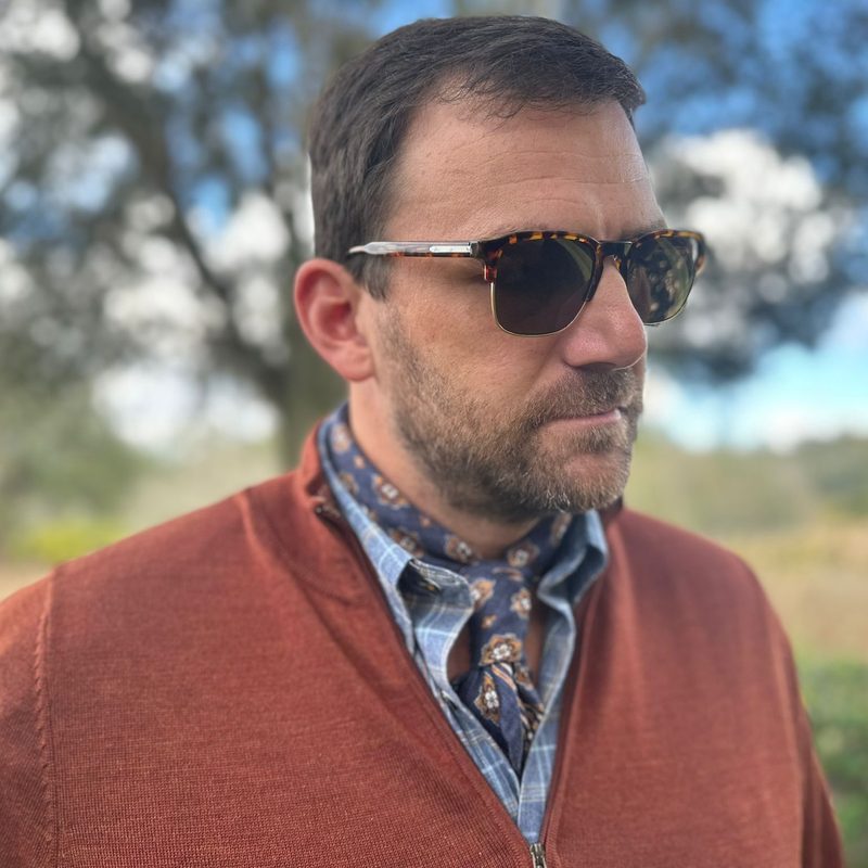 Man in neckerchief and glasses