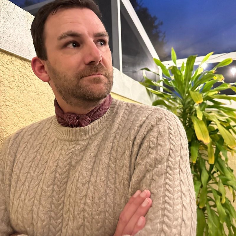 Man in neckerchief and sweater