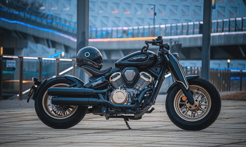 2025 Benda Napoleon Bob 500 parked on a wooden deck with a helmet on the seat.