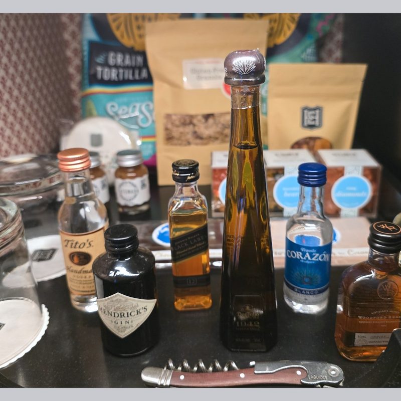 Hotel Emma'd mini bar stocked with spirits and snacks
