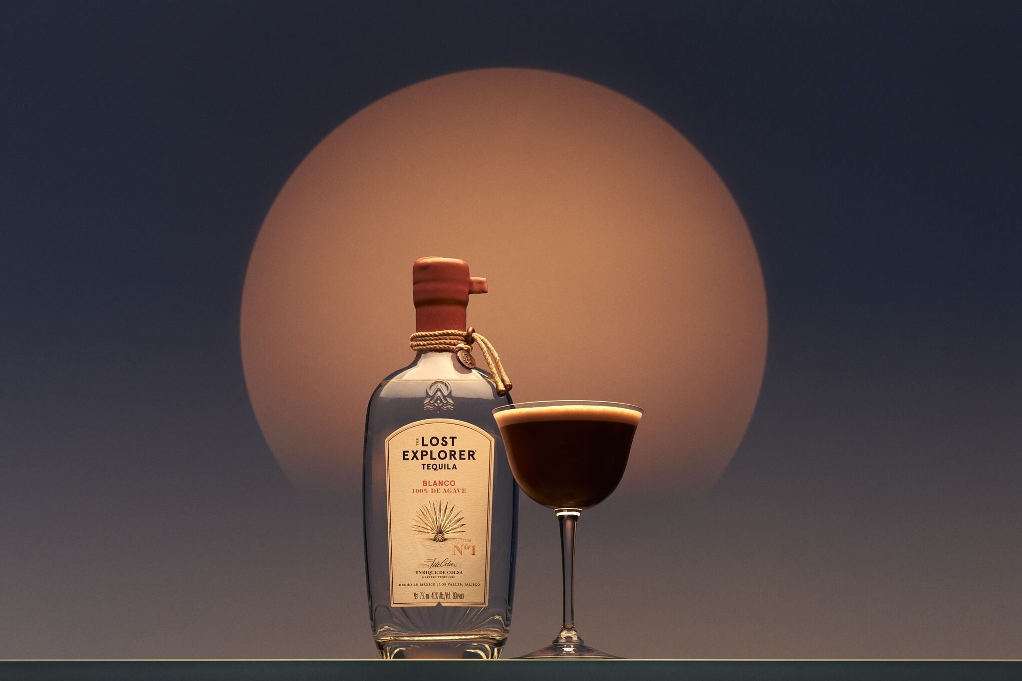 Tequila expresso martini image next to a bottle of the lost explorer