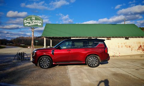 Nissan Armada parked in front of a convenience store