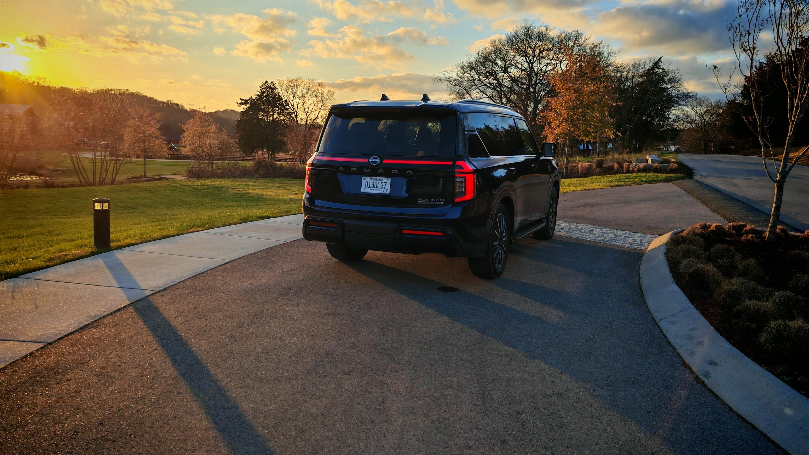 Rear 3/4 view of a Nissan Armada at sunset