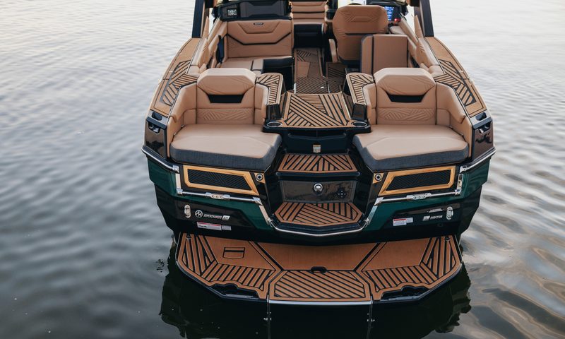 MasterCraft XStar X23 high performance wav and wakeboard boat on water view of seating from the rear.