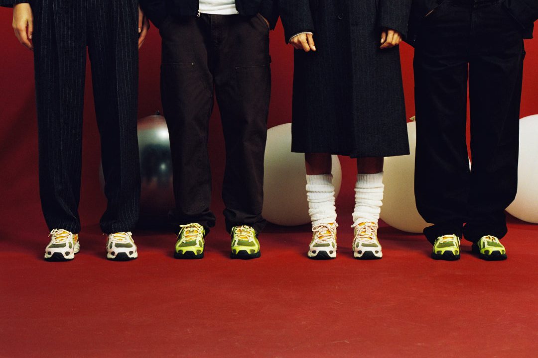 models in a row wearing sneakers
