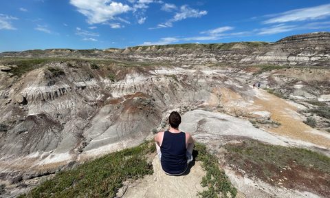 Sitting in Midland Provincial Park in the Alberta badlands