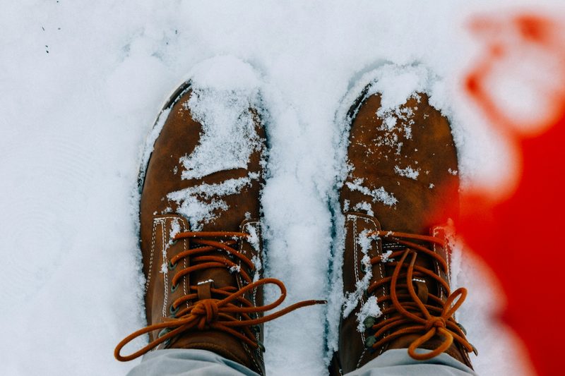 Man wearing hiking boots in the snow