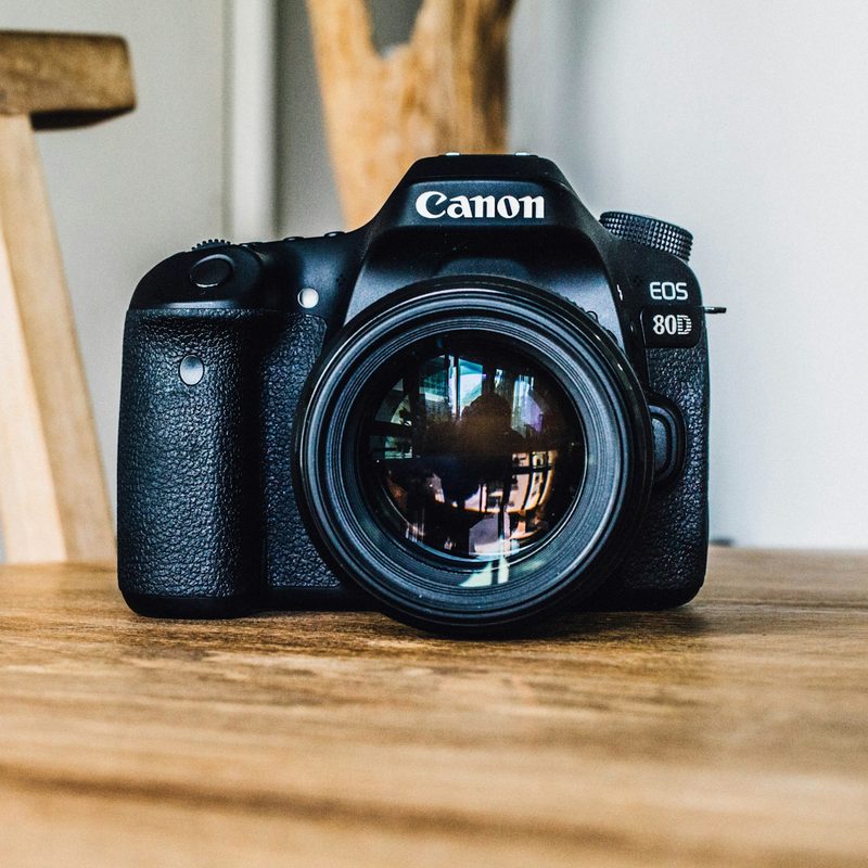 Nikon camera on a wooden table