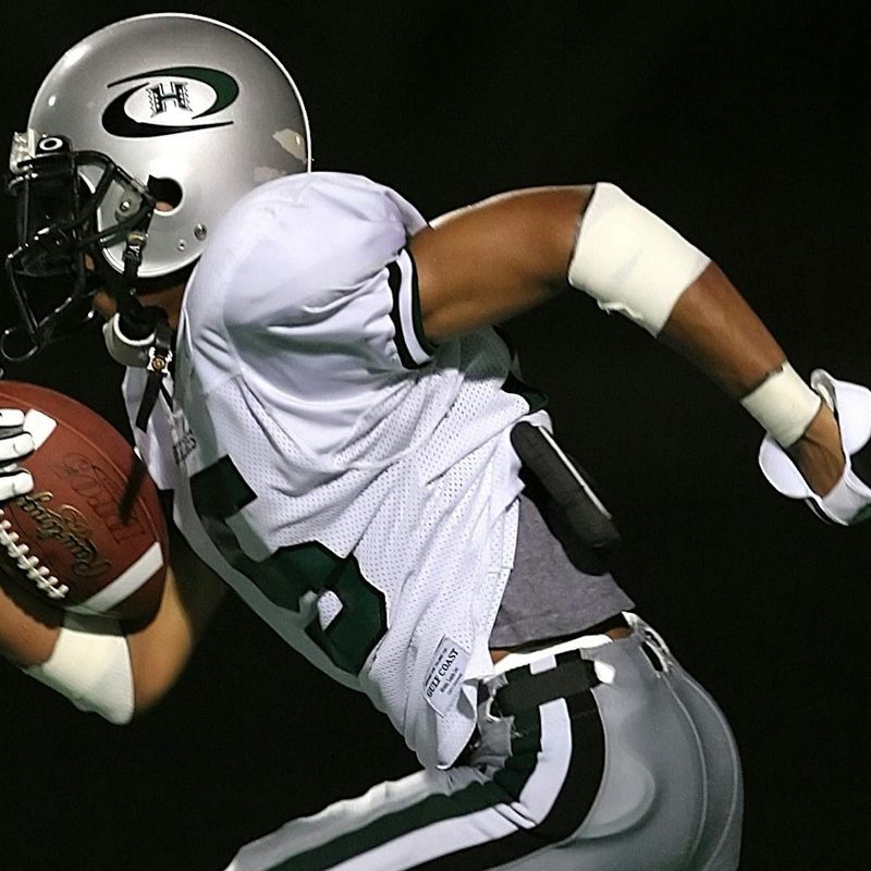 American football man running with a football