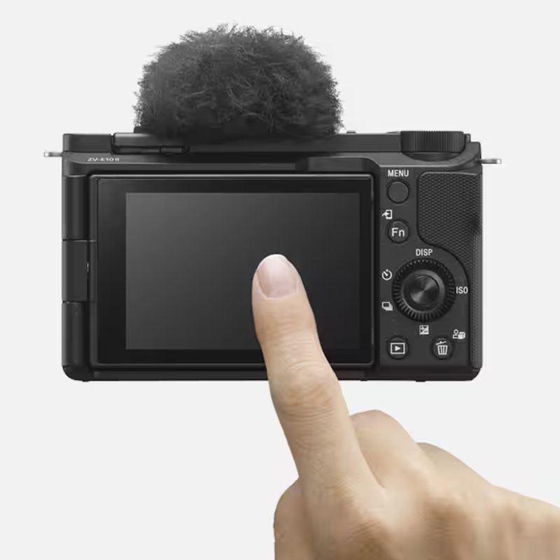 Back of a Sony Alpha ZVE10 II Creator's Camera with a finger touching the screen