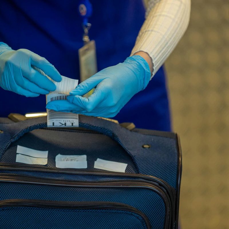 luggage gets airport security tag put on