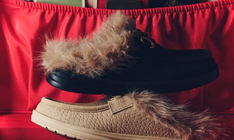 black and cream loafer in red suitcase