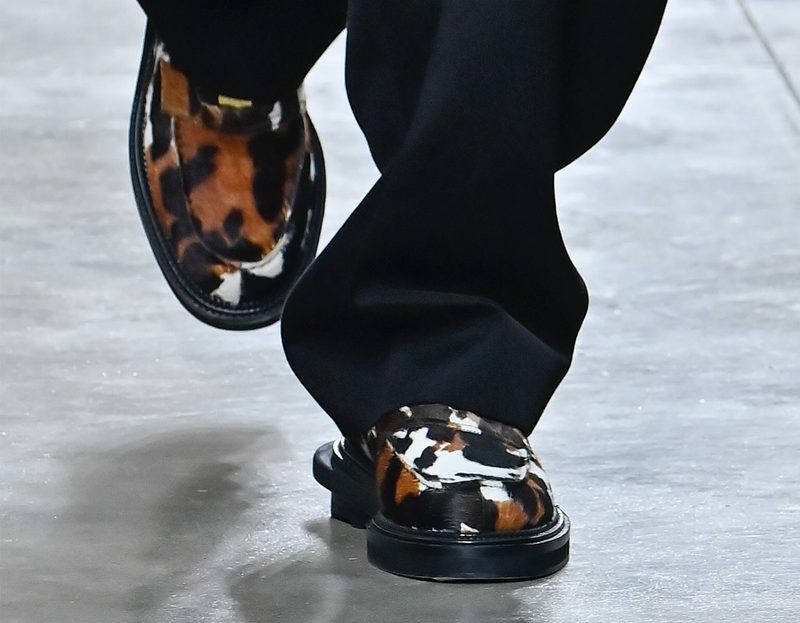 model wearing cowhide loafers