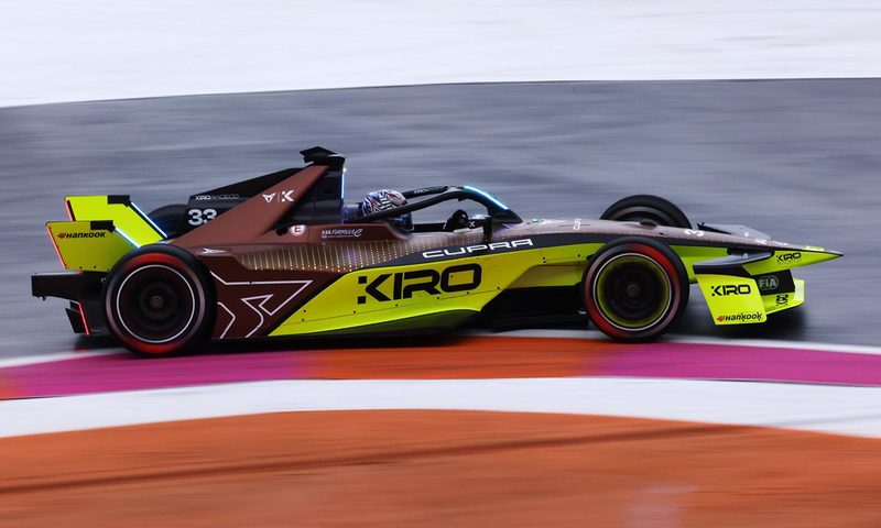 A Kiro Race Co race car on the track right profile image.