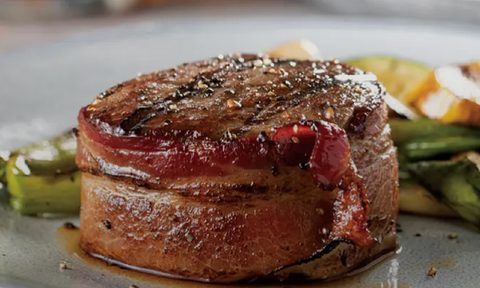 The Bacon-Wrapped Filet Mignon of Omaha Steak's Omaha Steaks Sampler on a plate.