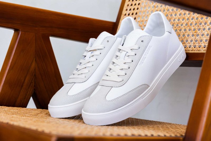 off white sneakers on rattan chairs