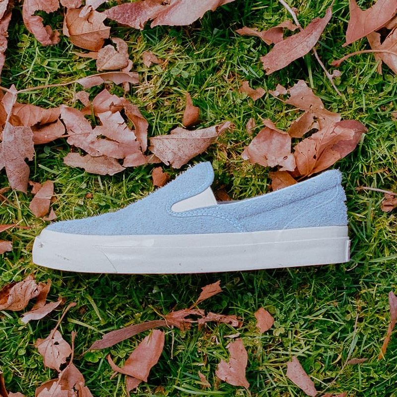 light blue slip on sneakers on grass