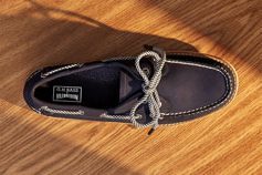 navy blue boat shoe on wood counter