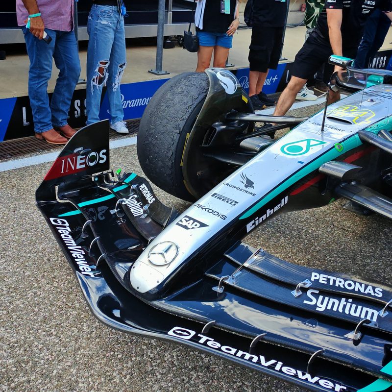 Medium compound tires on Lewis Hamilton's Mercedes F1 car showing heavy wear