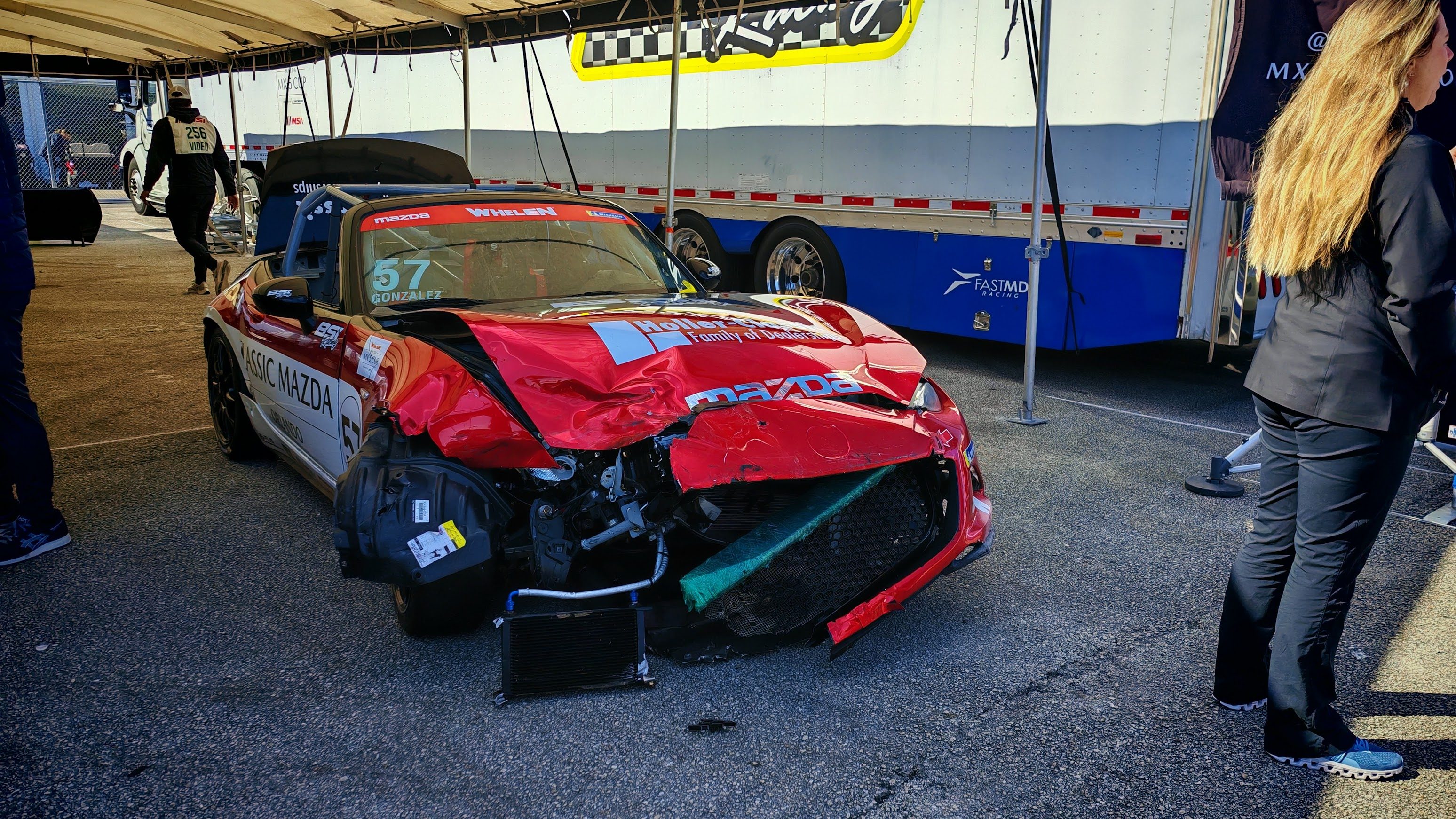 A damaged Miata from the MX-5 cup race 2