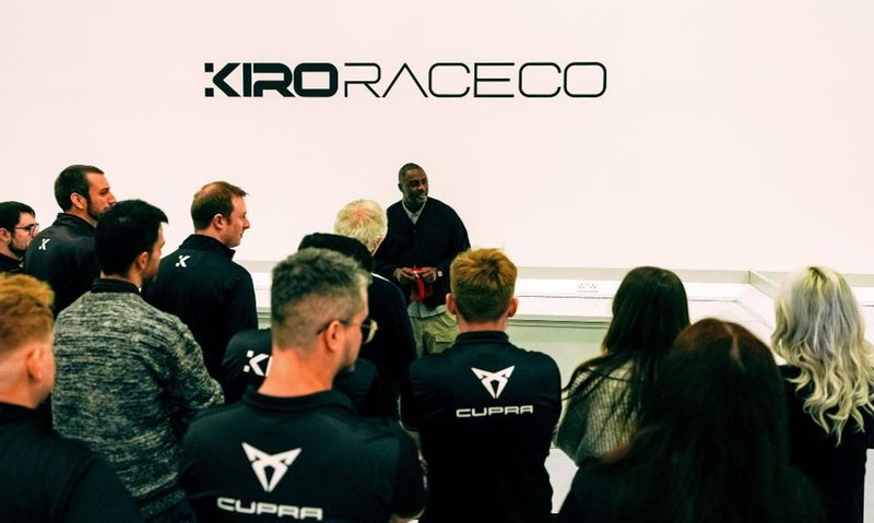 Idris Elba speaking before a crowd of Kiro Race Co employees.