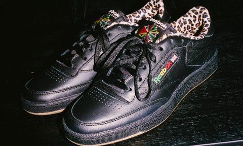 black reebok sneakers on counter