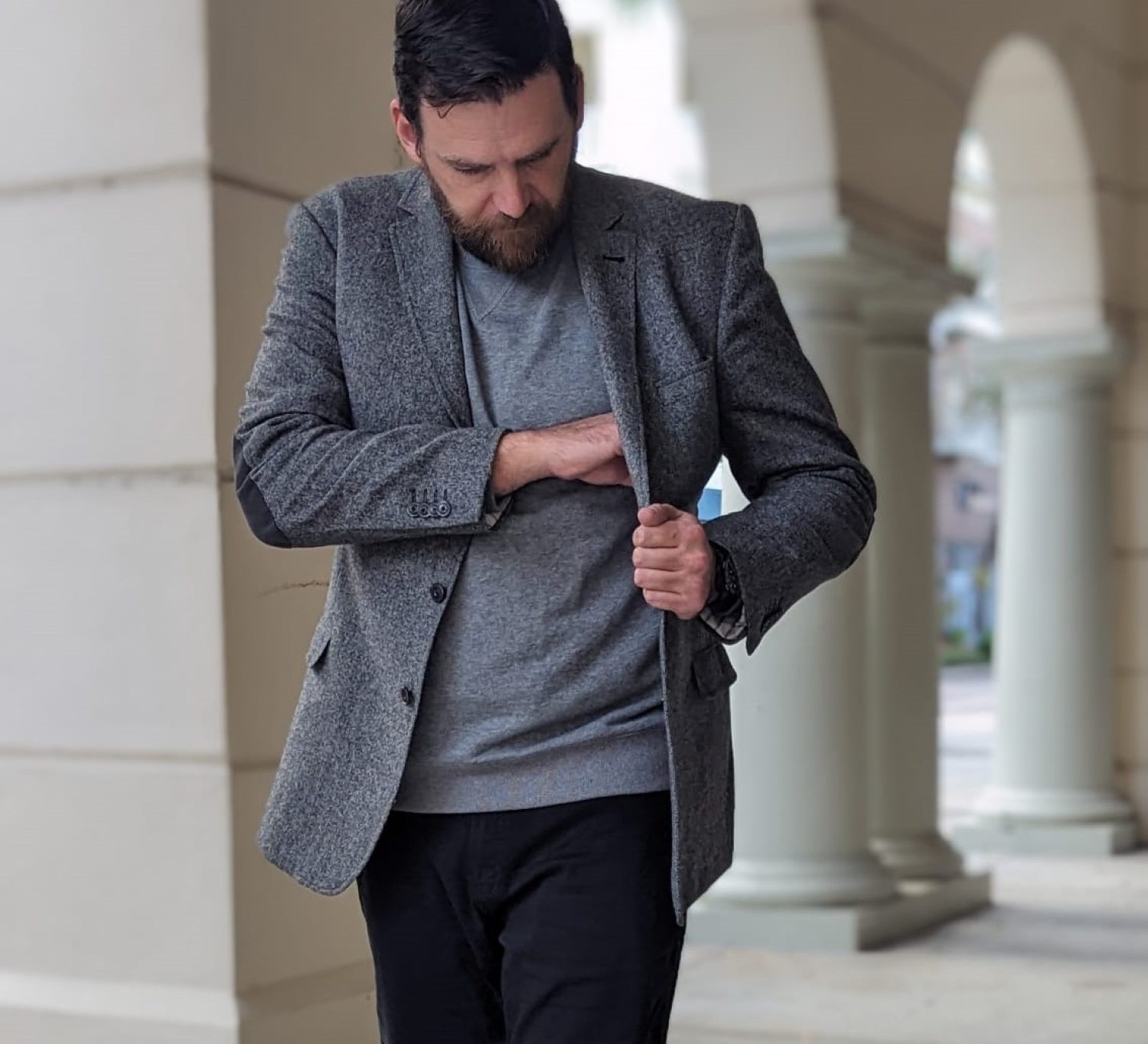 Man in gray tweed and jeans