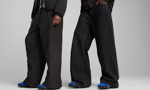 two models wearing puma mostro og sneakers