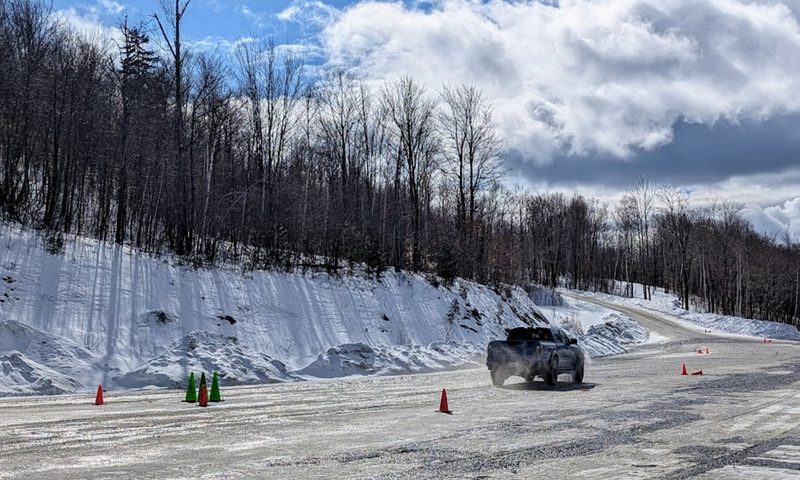 Ranger Raptor practicing winter driving obstacle avoidance on the slalom course at Team O'Neil.