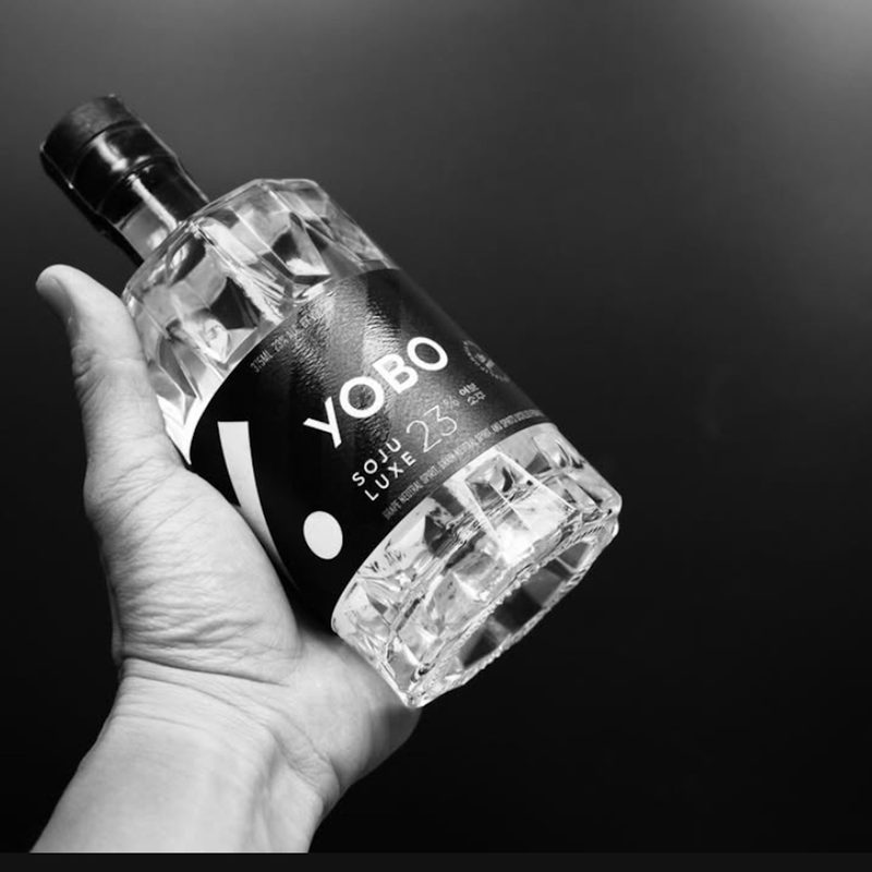 Hand holding bottle of Yobo Luxe