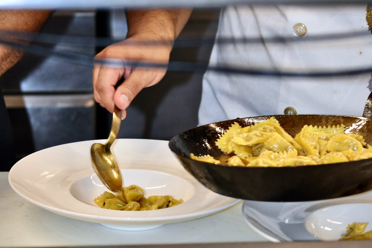 Plating pasta at Barolo Grill.