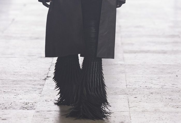 model wearing feather oversized boots