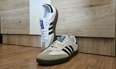adidas shoes leaning against wall