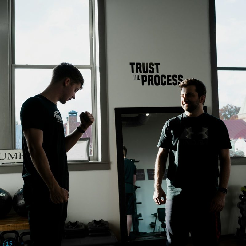 Personal training physical therapy two men in gym