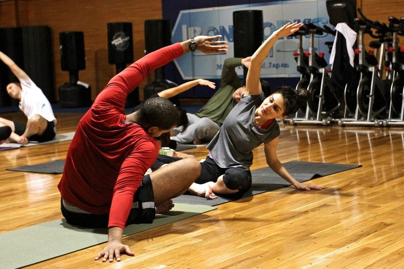 stretching yoga people in gym class