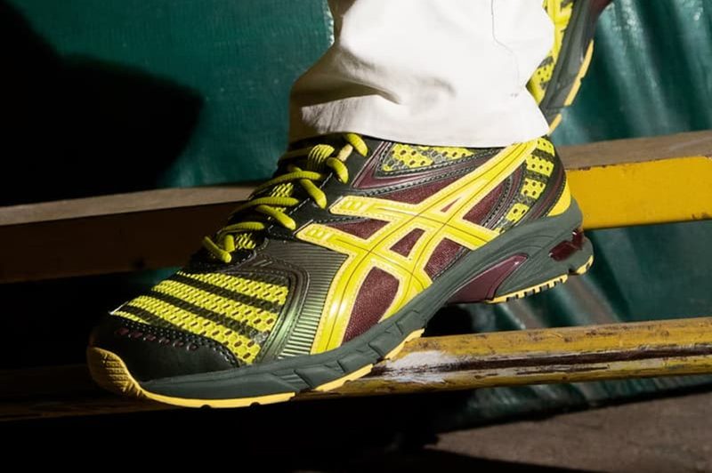 green and yellow ASICS sneaker