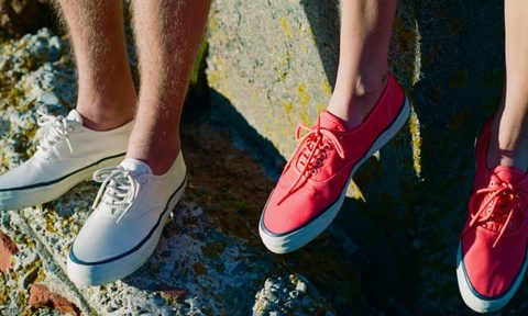 two people wearing sperry sneakers off ledge