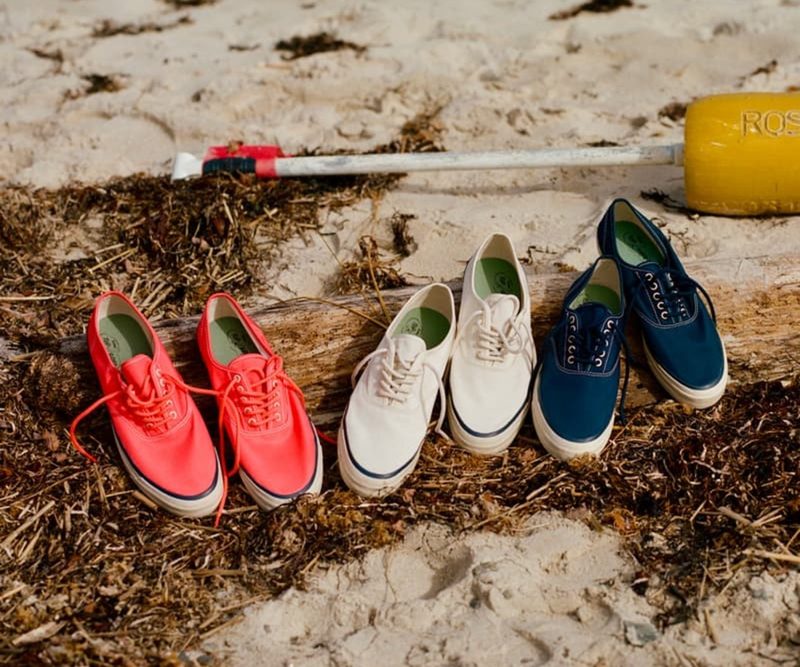 three pairs of sperry shoes in sand