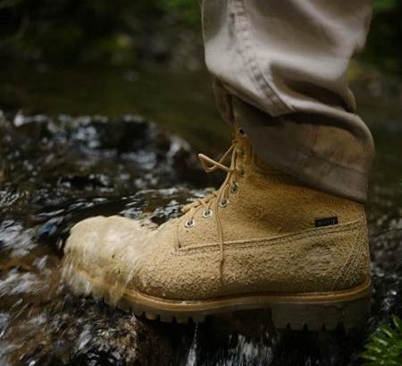 man wearing boot on rock